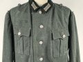 Feldbluse Modell 1935 für Mannschaften des Heeres. Stark getragenes Kammerstück, selten