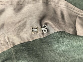 Heer, Feldbluse Modell 1943 für Mannschaften. Ausführung in Drillichmaterial, Kammerstück in sehr gutem Zustand, der Adler nachträglich vernäht