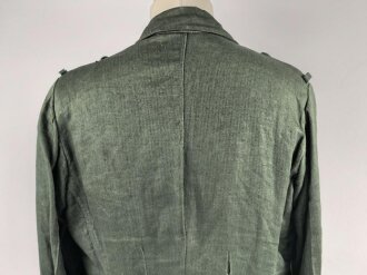 Heer, Feldbluse Modell 1943 für Mannschaften. Ausführung in Drillichmaterial, Kammerstück in sehr gutem Zustand, der Adler nachträglich vernäht