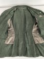 Heer, Feldbluse Modell 1943 für Mannschaften. Ausführung in Drillichmaterial, Kammerstück in sehr gutem Zustand, der Adler nachträglich vernäht