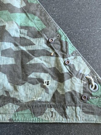 Zeltbahn 31 Wehrmacht. Getragenes, farbfrisches Stück in gutem Gesamtzustand, mit Reichsbetriebsnummer
