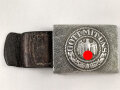 Koppelschloss für Mannschaften des Heeres. Aluminium,  an Lederzunge von 1937. das Hakenkreuz Breitgeklopft, aber noch sichtbar
