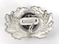 Eichenlaubkranz mit Kokarde für eine Schirmmütze des Heeres. Aluminium, datiert 1939