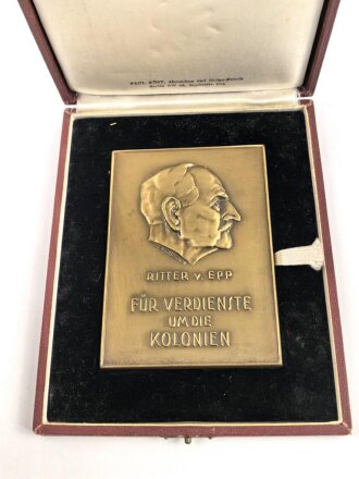 Plakette "Für Verdienste um die Kolonien" Ritter von Epp in bronze. Plakette in sehr gutem Zustand, in leicht bestossenem Etui. Maße des Etuis 14 x 18cm