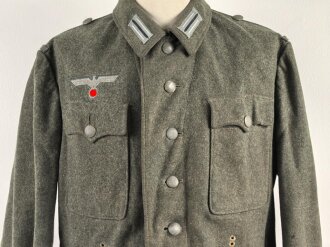 Heer, Feldbluse für Mannschaften Modell 1942,  getragenes Kammerstück in gutem Gesamtzustand, die Effekten neuzeitlich vernäht.