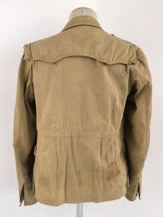 Waffen SS Tropenfeldbluse , sogenannte Sahariana. Getragenes Kammerstück mit original vernähtem Ärmaladler. Ungereinigt