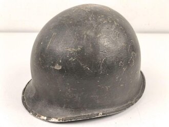 U.S. WWII steel helmet shell, front seam. Reused by U.S. Army after WWII. Uncleaned