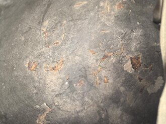 U.S. WWII steel helmet shell, front seam. Reused by U.S. Army after WWII. Uncleaned