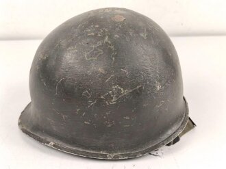 U.S. WWII steel helmet shell, front seam. Reused by U.S. Army after WWII. Uncleaned