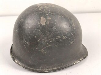 U.S. WWII steel helmet shell, front seam. Reused by U.S. Army after WWII. Uncleaned