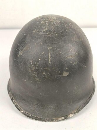 U.S. WWII steel helmet shell, front seam. Reused by U.S. Army after WWII. Uncleaned