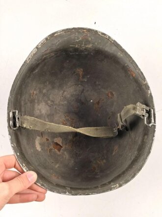 U.S. WWII steel helmet shell, front seam. Reused by U.S. Army after WWII. Uncleaned