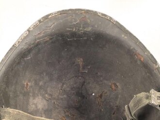 U.S. WWII steel helmet shell, front seam. Reused by U.S. Army after WWII. Uncleaned