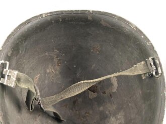 U.S. WWII steel helmet shell, front seam. Reused by U.S. Army after WWII. Uncleaned