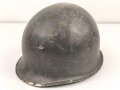 U.S. WWII steel helmet shell, front seam. Reused by U.S. Army after WWII. Uncleaned