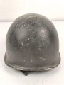 U.S. WWII steel helmet shell, front seam. Reused by U.S. Army after WWII. Uncleaned