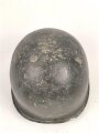 U.S. WWII steel helmet shell, front seam. Reused by U.S. Army after WWII. Uncleaned