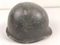 U.S. WWII steel helmet shell, front seam. Reused by U.S. Army after WWII. Uncleaned