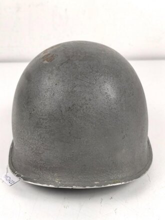 U.S. WWII steel helmet shell, front seam, fixed bail. Reused by U.S. Army after WWII, cleaned.