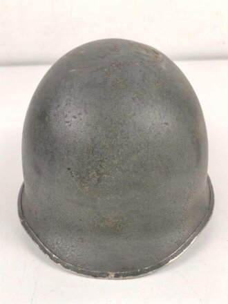 U.S. WWII steel helmet shell, front seam, fixed bail. Reused by U.S. Army after WWII, cleaned.