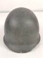 U.S. WWII steel helmet shell, front seam, fixed bail. Reused by U.S. Army after WWII, cleaned.