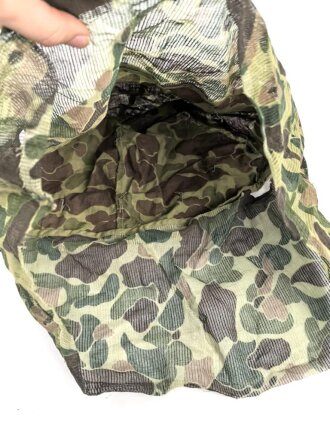 U.S. Marine Corps WWII, “Duck Hunter” camo helmet cover with mosquito net. Unfortunately cut down