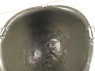 U.S. Army WWII, front seam M1 steel helmet shell. Original paint, no idea when the number was attached