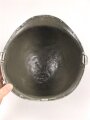 U.S. Army WWII, front seam M1 steel helmet shell. Original paint, no idea when the number was attached