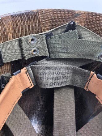 U.S. Army, M1 steel helmet . Liner sweatband dated 1985, Woodland cover dated 1982.