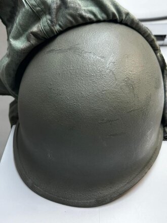 U.S. Army, M1 steel helmet . Liner sweatband dated 1985, Woodland cover dated 1982.