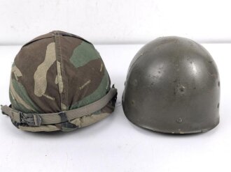 U.S. Army, M1 steel helmet . Liner sweatband dated 1985, Woodland cover dated 1982.