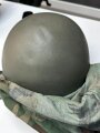 U.S. Army, M1 steel helmet . Liner sweatband dated 1985, Woodland cover dated 1982.