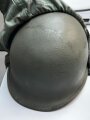 U.S. Army, M1 steel helmet . Liner sweatband dated 1985, Woodland cover dated 1982.