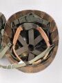 U.S. Army, M1 steel helmet . Liner sweatband dated 1985, Woodland cover dated 1982.