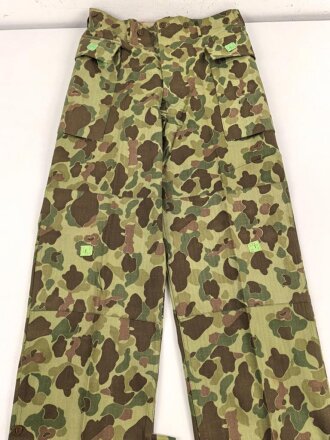 U.S. Army, 1943 dated Camo HBT combat trousers. Unissued,...