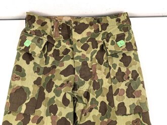 U.S. Army, 1943 dated Camo HBT combat trousers. Unissued,...