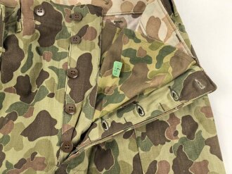 U.S. Army, 1943 dated Camo HBT combat trousers. Unissued, with cutters tags. Size 34 x 31, King Kard Overall Co.