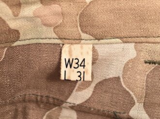 U.S. Army, 1943 dated Camo HBT combat trousers. Unissued, with cutters tags. Size 34 x 31, King Kard Overall Co.