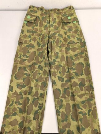 U.S. Army, 1943 dated Camo HBT combat trousers. Unissued,...