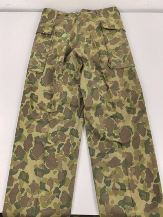 U.S. Army, 1943 dated Camo HBT combat trousers. Unissued, with cutters tags. Size 34 x 31, King Kard Overall Co.