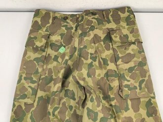 U.S. Army, 1943 dated Camo HBT combat trousers. Unissued, with cutters tags. Size 34 x 31, King Kard Overall Co.