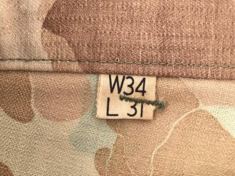 U.S. Army, 1943 dated Camo HBT combat trousers. Unissued, with cutters tags. Size 34 x 31, King Kard Overall Co.