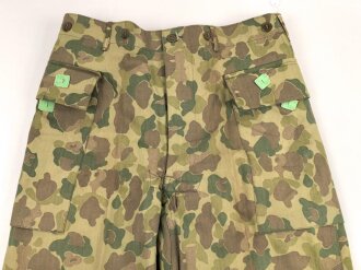 U.S. Army, 1943 dated Camo HBT combat trousers. Unissued,...