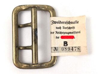 Zweidornschnalle nach Vorschrift der NSDAP. 58mm Höhe, vergoldet. Ungetragen, mit RZM Etikett