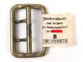 Zweidornschnalle nach Vorschrift der NSDAP. 58mm Höhe, vergoldet. Ungetragen, mit RZM Etikett
