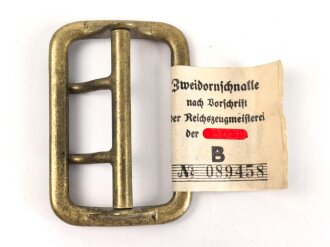 Zweidornschnalle nach Vorschrift der NSDAP. 58mm Höhe, vergoldet. Ungetragen, mit RZM Etikett