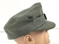 Bergmütze für Gebirgstruppen der Wehrmacht. Getragenes Stück, die Effekten original vernäht, Kopfgrösse 55
