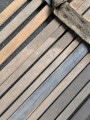 Vorrichtung zum bergen Verwundeter im Gebirge. Die Holzlattung mittig 132cm lang. Sowohl zum hinterherziehen im Schnee als auch zum Abseilen gedacht. Ungereinigtes Stück