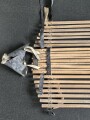 Vorrichtung zum bergen Verwundeter im Gebirge. Die Holzlattung mittig 132cm lang. Sowohl zum hinterherziehen im Schnee als auch zum Abseilen gedacht. Ungereinigtes Stück