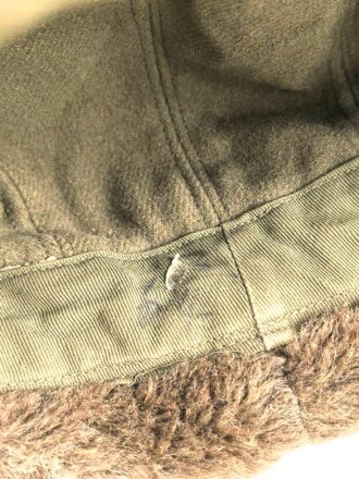U.S. Army , M51 pile cap, well used, size 56. Uncleaned